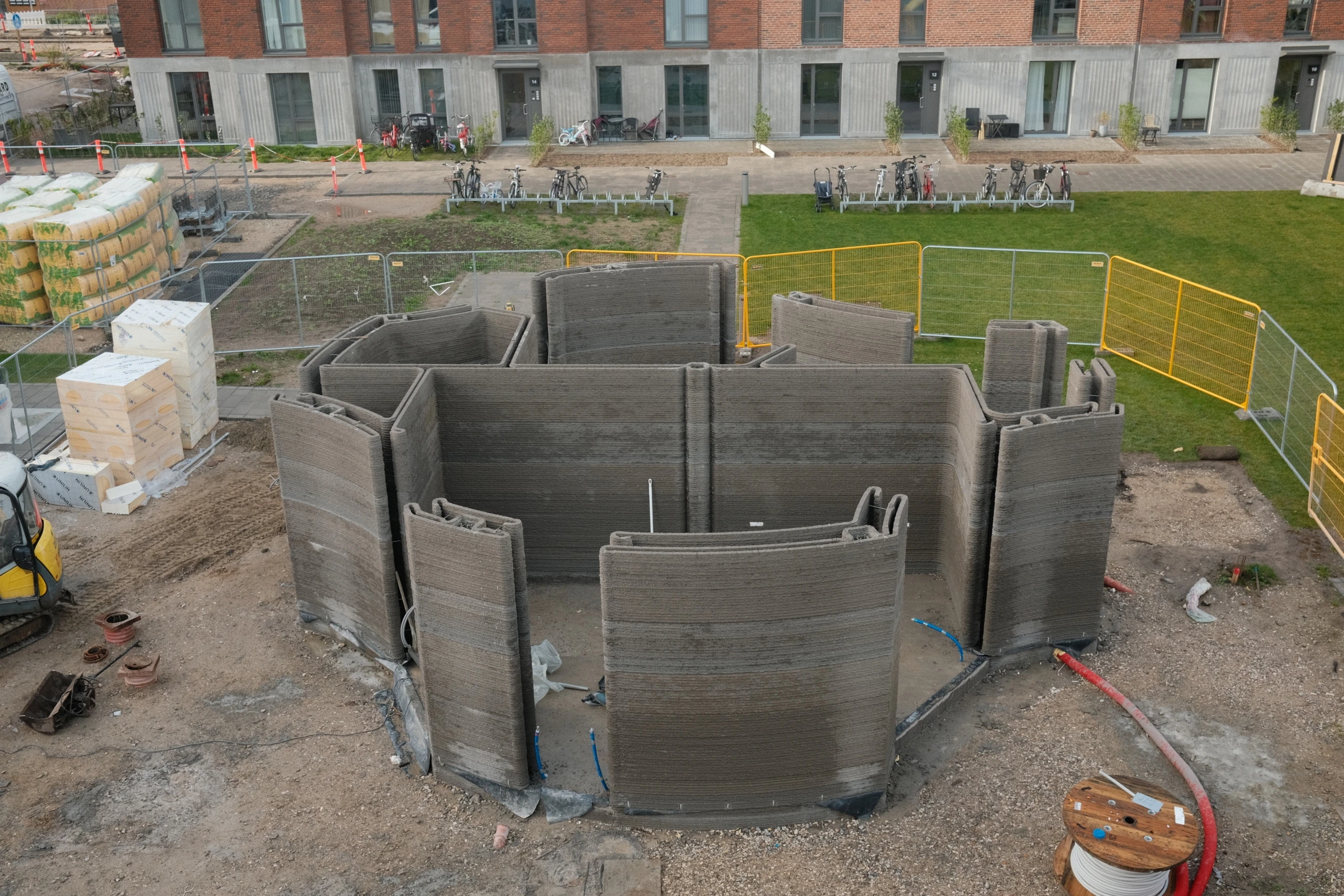 Aerial image of the 3D-printed Community House under construction