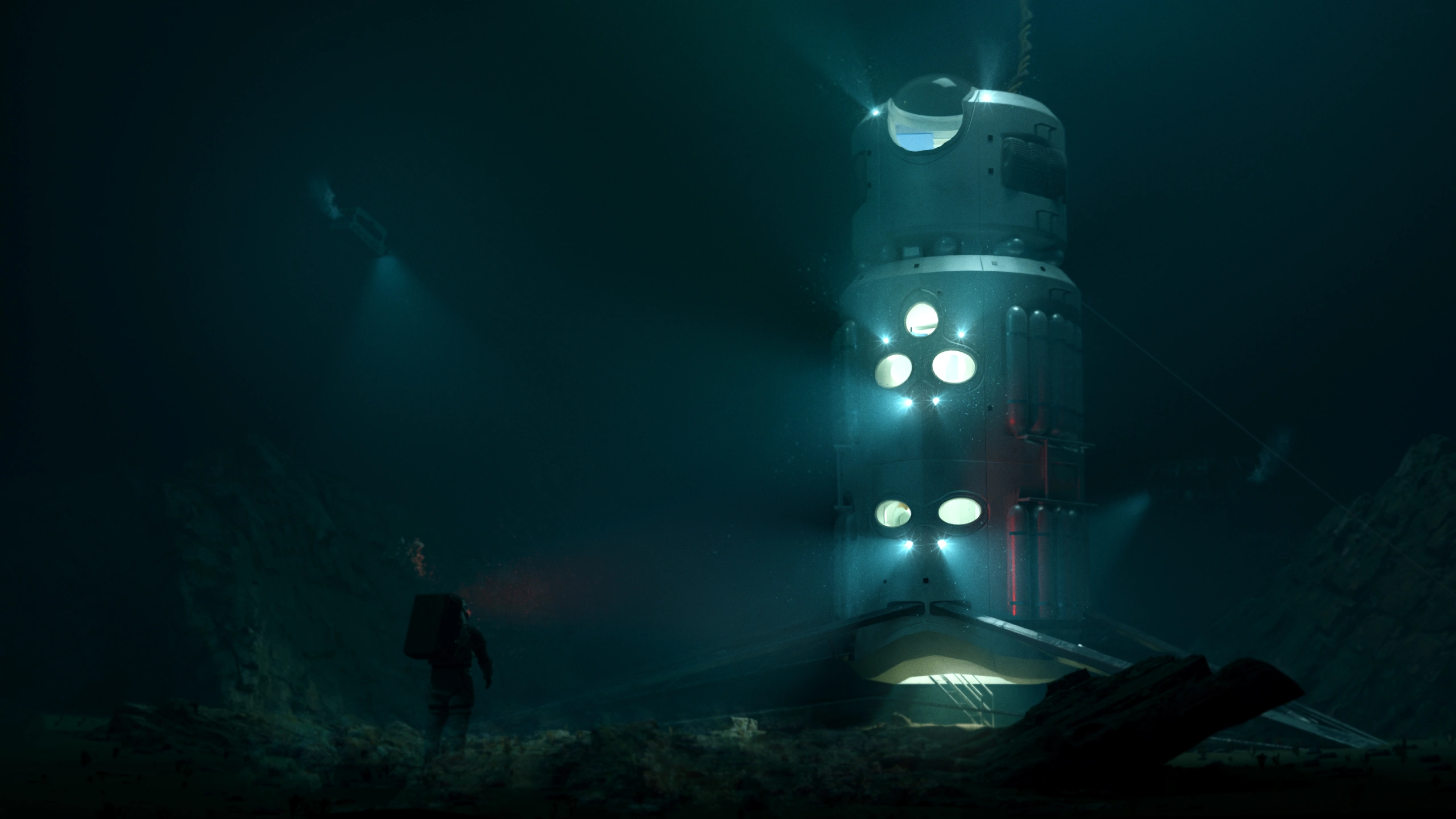 Full scale habitat underwater with aquanaut standing outside