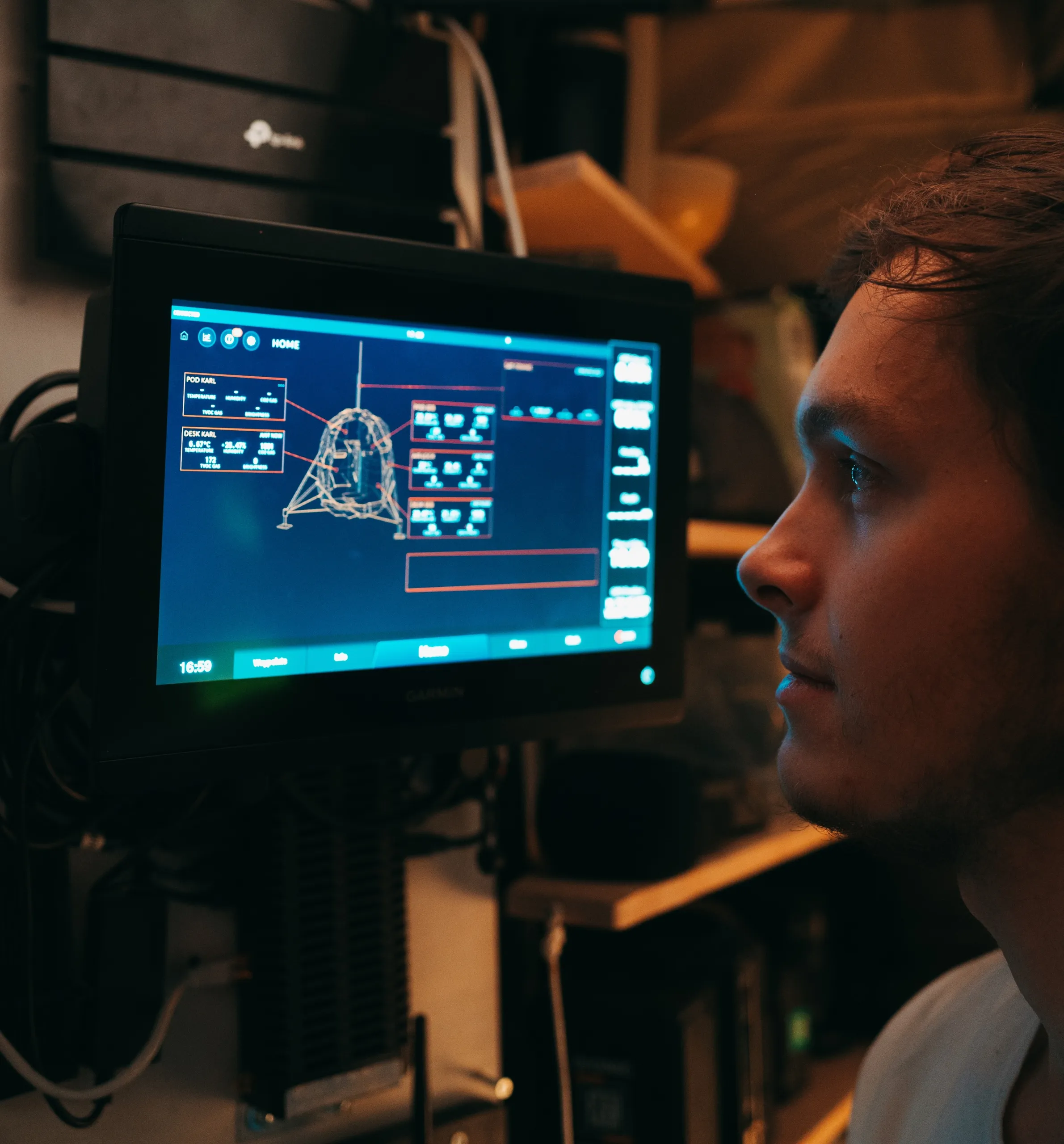 Image of Karl looking at Odin interface inside Lunark habitat