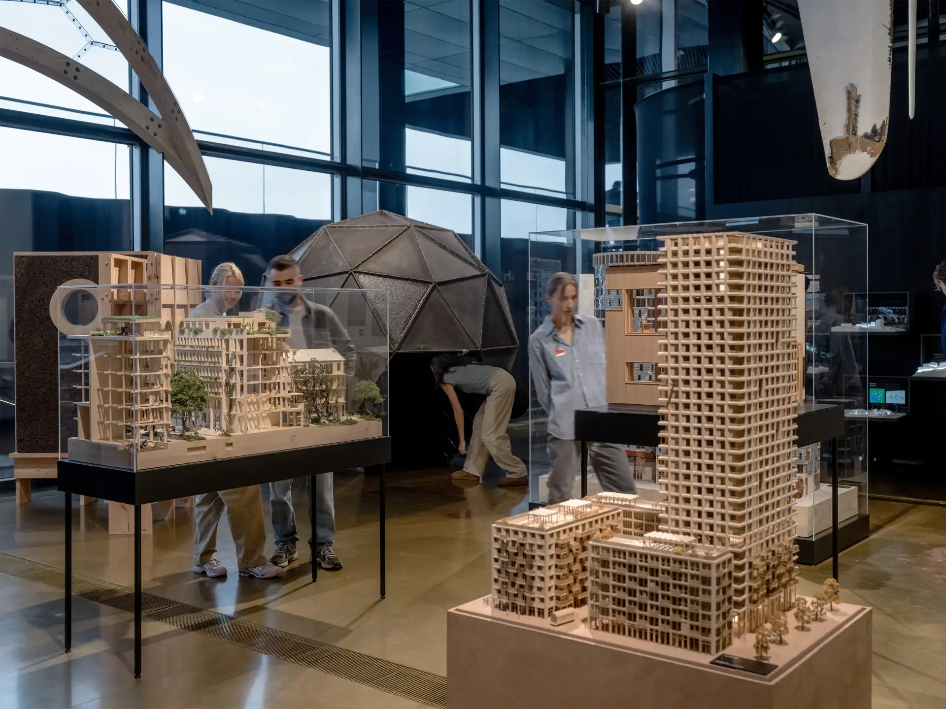 The overview effect dome adorning the 'So Danish' exhibition at Danish Architecture Center with more traditional building exhibits in front.