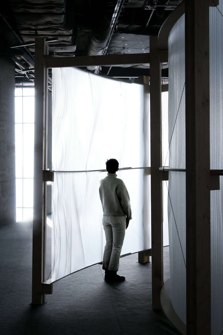 A person standing in the entrance of the pavilion.