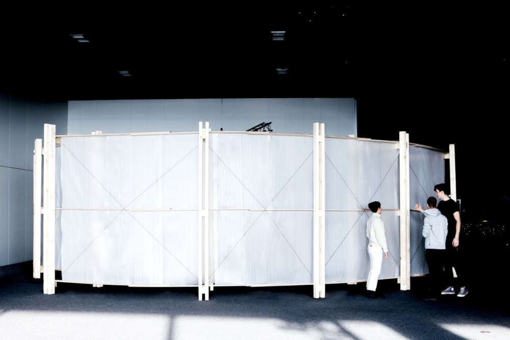 Pavilion being inspected by 3 people.