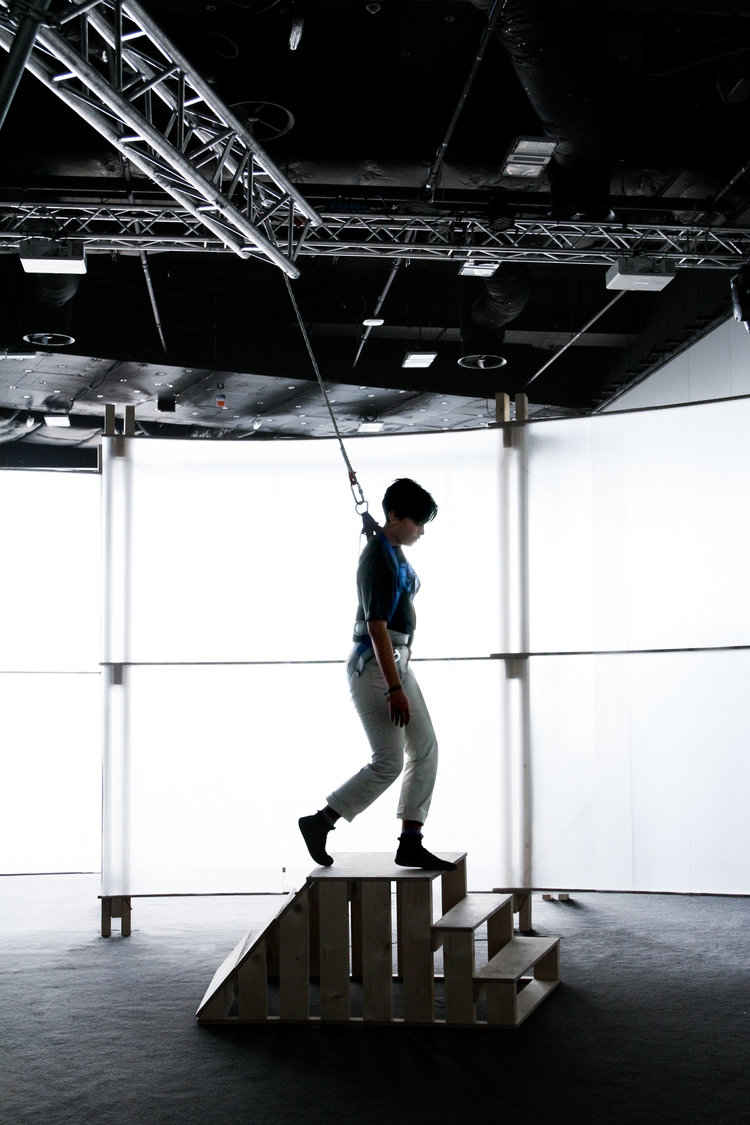 Here a participant walks down a staircase only weighing 38% of her normal weight. This is one of three staircases each testing a different angle.